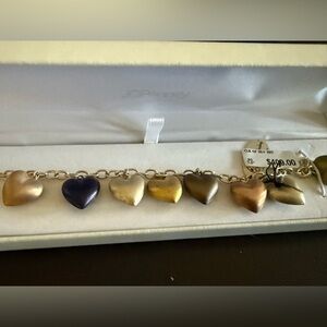 Sterling colored silver in a Heart Charm Bracelet. Giftable Brand new w/ tags